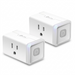 A detailed high-resolution product photograph of two TP-Link Kasa Smart Wi-Fi Plug Lite HS103 smart plugs, floating side-by-side with realistic shadows against a clean, brilliant white background. Both show the correct 3-prong North American sockets and integrated power buttons with status indicators, exactly as featured in the reference image.